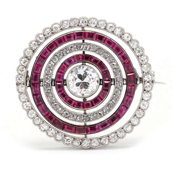 Diamond and ruby swivelling target cluster brooch